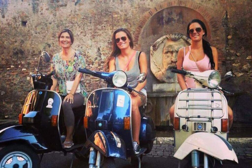 Three friends riding vintage Vespas in front of a historic Montreal fountain.